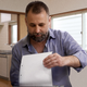 Image for article titled Dad Shredding Old Junk Mail With Intensity Of Watergate 7